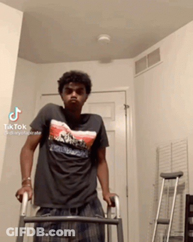 A Man Is Using A Walker In A Room With A Tiktok Watermark GIF