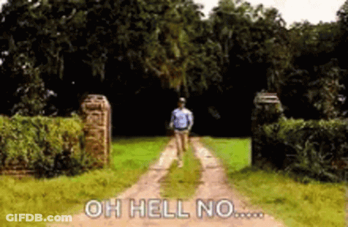 A Man Is Walking Down A Dirt Road With The Words `` Oh Hell No '' Written On The Ground . GIF