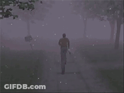 A Man Is Walking Down A Foggy Road With Trees In The Background GIF