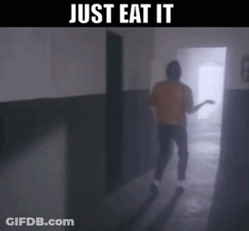 A Man Is Walking Down A Hallway With The Words Just Eat It On The Bottom GIF