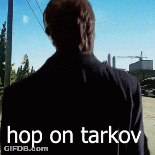 A Man Is Walking Down A Street With The Words Hop On Tarkov On His Back GIF
