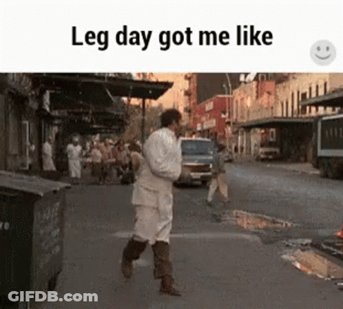 A Man Is Walking Down A Street With The Words Leg Day Got Me Like . GIF