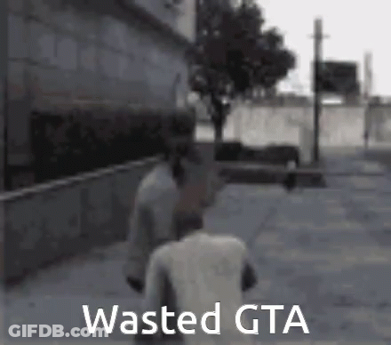 A Man Is Walking Down A Street With The Words `` Wasted Gta '' Written On The Bottom Of The Image . GIF