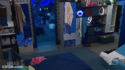 A Man Is Walking In A Room With The Hashtag #Bbad On The Bottom GIF