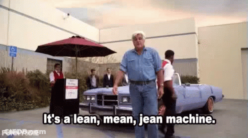 A Man Is Walking In Front Of A Car And Says It 'S A Lean Mean Jean Machine GIF