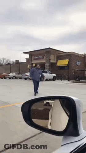 A Man Is Walking In Front Of A Race Pac Restaurant GIF
