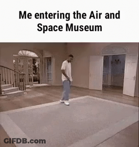 A Man Is Walking On A Rug In A Room With The Caption `` Me Entering The Air And Space Museum '' . GIF