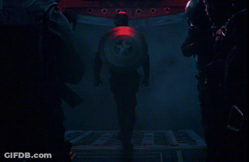A Man Is Walking Through A Dark Room And The Words Too Busy Are Visible GIF