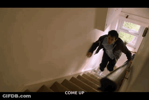 A Man Is Walking Up A Set Of Stairs With The Words Come Up Written Below Him GIF