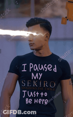 A Man Is Wearing A Black Shirt That Says I Paused My Sekiro Just To Be Here GIF