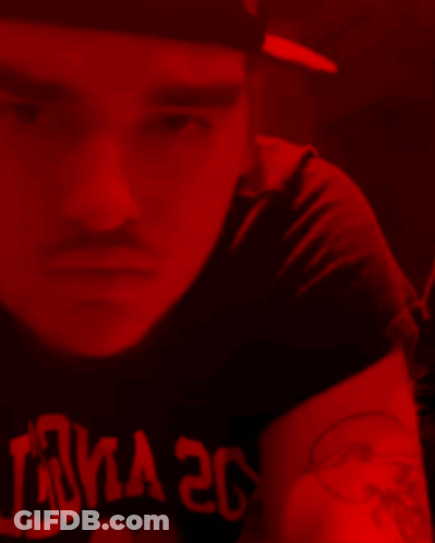 A Man Is Wearing A Black Shirt That Says Luna 20 On It GIF
