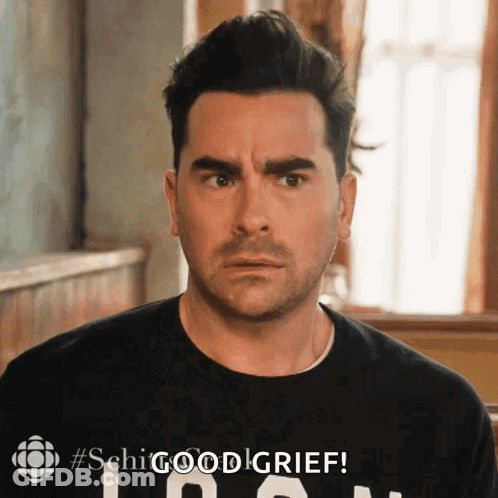 A Man Is Wearing A Black Shirt That Says ' Shg Good Grief ' On It GIF