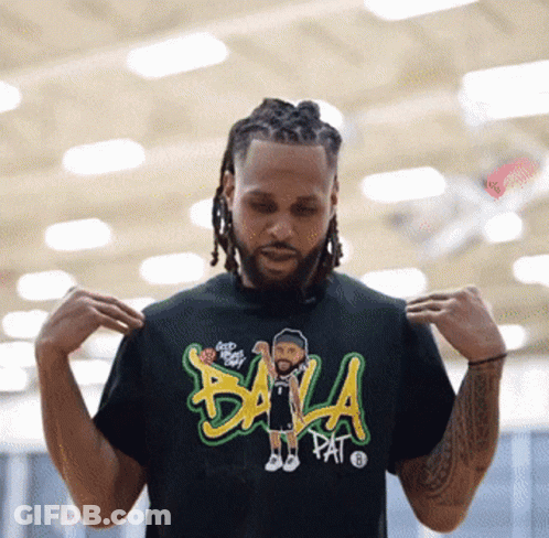 A Man Is Wearing A Black T-Shirt That Says Bala Pat On It GIF