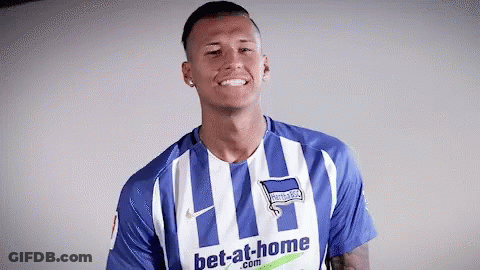 A Man Is Wearing A Blue And White Striped Shirt That Says Bet-At-Home GIF