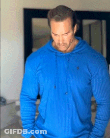 Man In Blue Hoodie In Front Of Mirror GIF