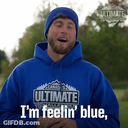 A Man Is Wearing A Blue Hoodie That Says Ultimate Challenge GIF