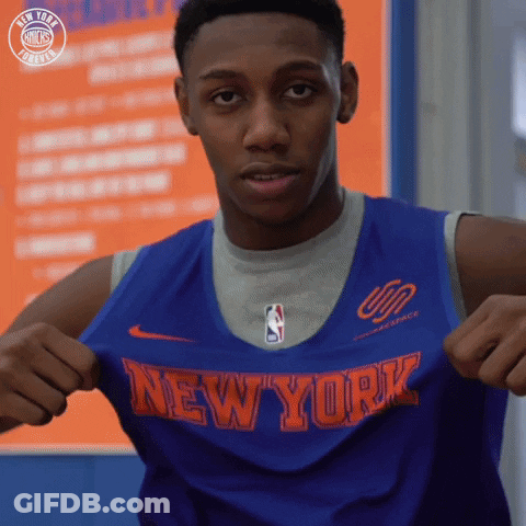 A Man Is Wearing A Blue Jersey That Says New York On It GIF