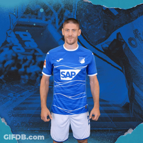 A Man Is Wearing A Blue Shirt With The Word Sap On It GIF