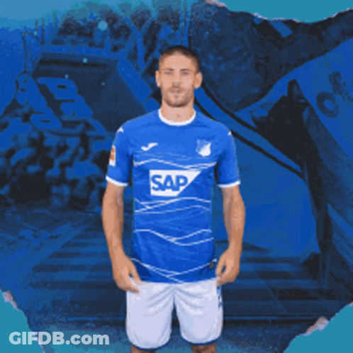 A Man Is Wearing A Blue Shirt With The Word Sap On It GIF