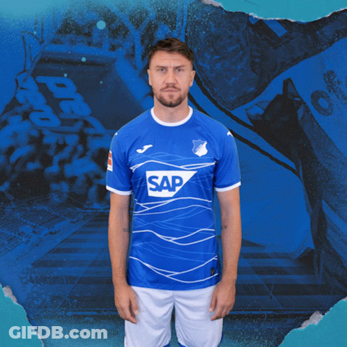 A Man Is Wearing A Blue Shirt With The Word Sap On It GIF