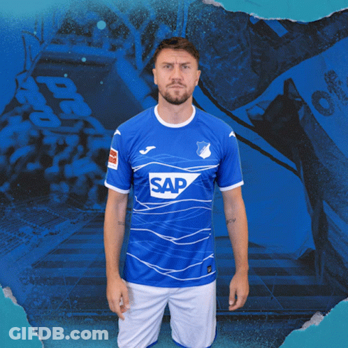 A Man Is Wearing A Blue Shirt With The Word Sap On It GIF