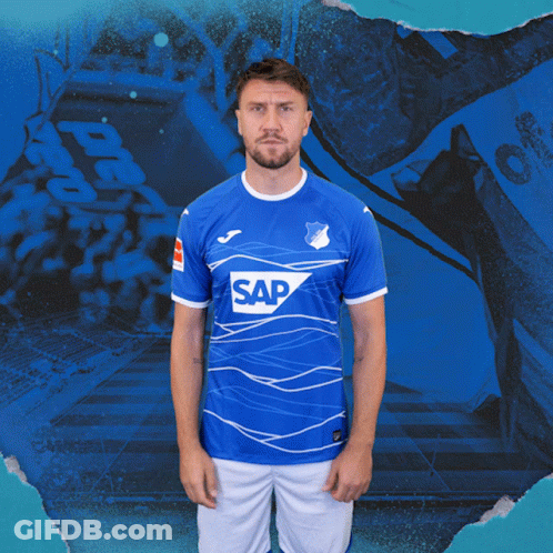 A Man Is Wearing A Blue Shirt With The Word Sap On It GIF