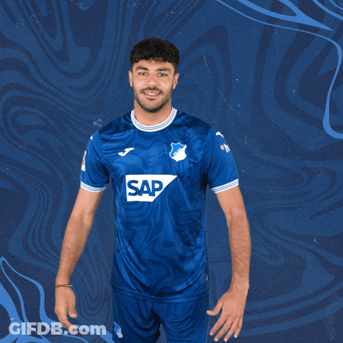A Man Is Wearing A Blue Shirt With The Word Sap On It GIF
