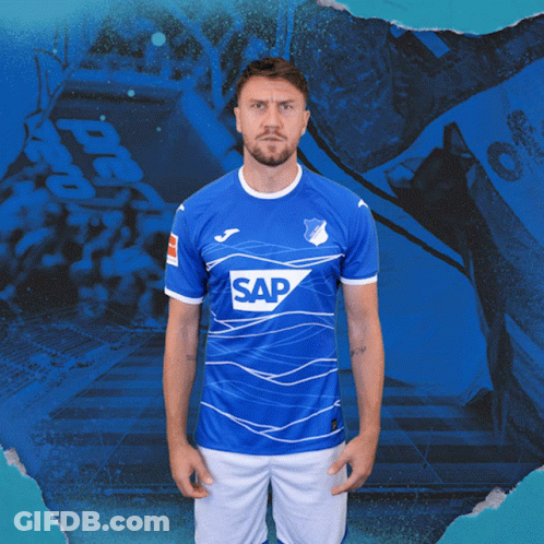 A Man Is Wearing A Blue Shirt With The Word Sap On It GIF