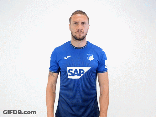 A Man Is Wearing A Blue Shirt With The Word Sap On It GIF