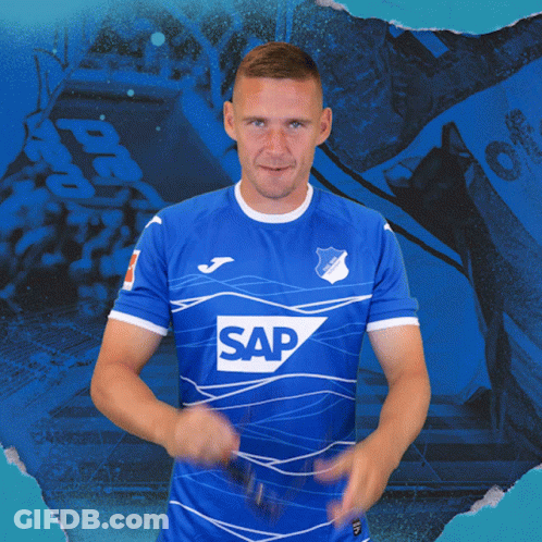 A Man Is Wearing A Blue Shirt With The Word Sap On It GIF