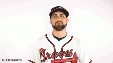 A Man Is Wearing A Braves Jersey And A Hat GIF