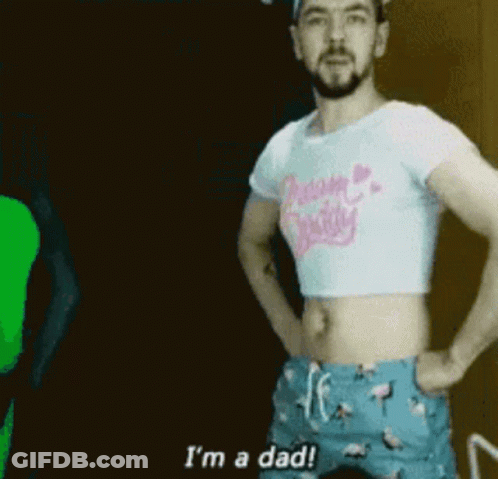 A Man Is Wearing A Crop Top And Shorts And Says I 'M A Dad . GIF