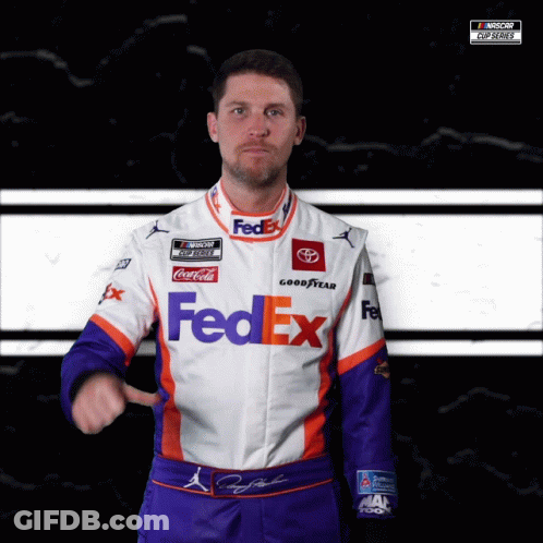 A Man Is Wearing A Fedex Uniform And Pointing GIF