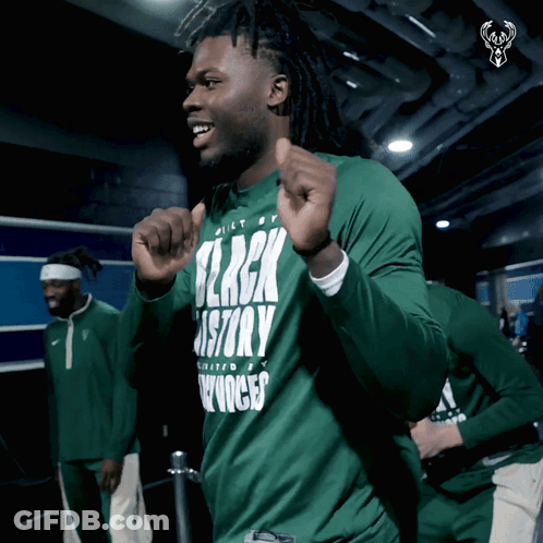 A Man Is Wearing A Green Shirt That Says Black History GIF