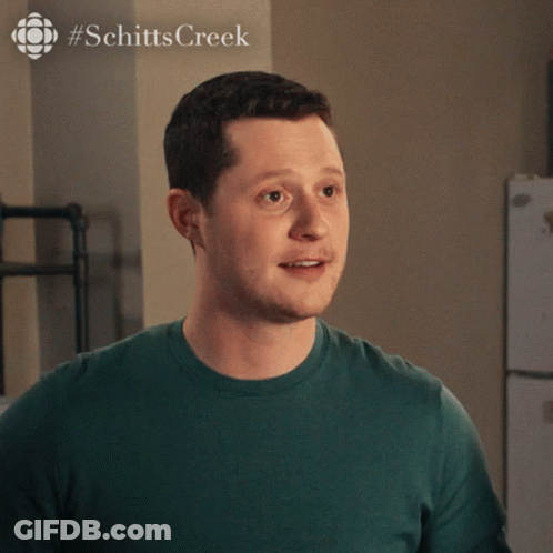 A Man Is Wearing A Green Shirt That Says Thank You GIF