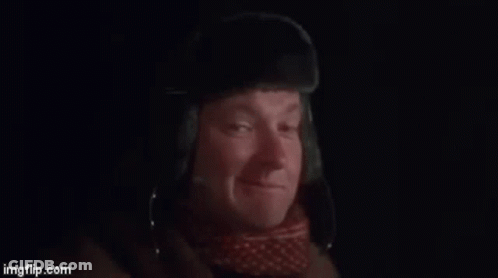 A Man Is Wearing A Hat And Saying Bingo . GIF