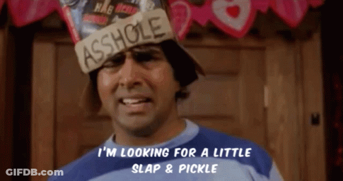 A Man Is Wearing A Hat That Says Asshole On It GIF