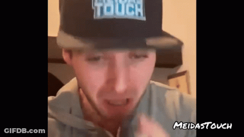 A Man Is Wearing A Hat That Says Touch On It GIF