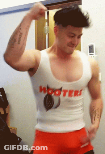 A Man Is Wearing A Hooters Tank Top GIF