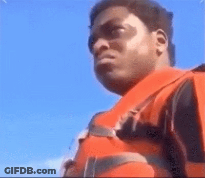 A Man Is Wearing A Life Jacket And Sunglasses . GIF