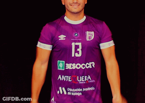 A Man Is Wearing A Purple Jersey With The Number 13 On It GIF