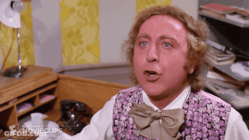 A Man Is Wearing A Purple Vest And Bow Tie And A Fandango Movie Clip GIF