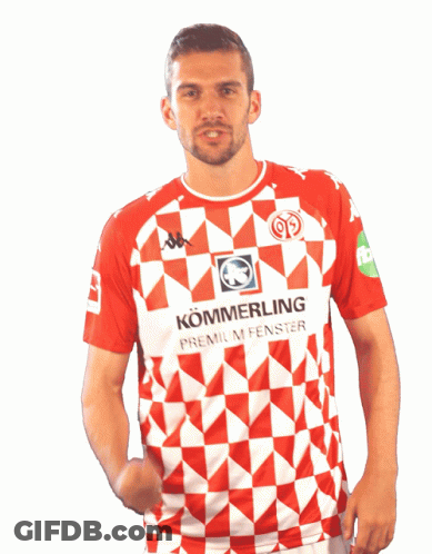 A Man Is Wearing A Red And White Shirt That Says Kommerling GIF