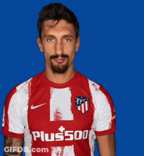 A Man Is Wearing A Red And White Shirt That Says Plus500 GIF