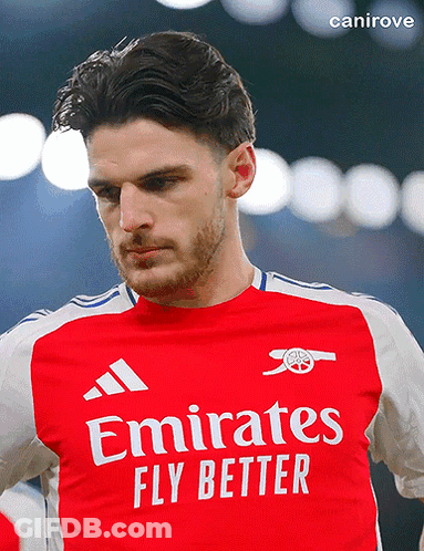 A Man Is Wearing A Red Emirates Fly Better Jersey GIF