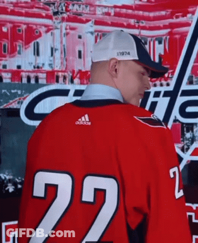 A Man Is Wearing A Red Jersey With The Number 22 On It GIF