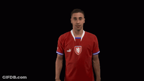 A Man Is Wearing A Red Puma Shirt GIF