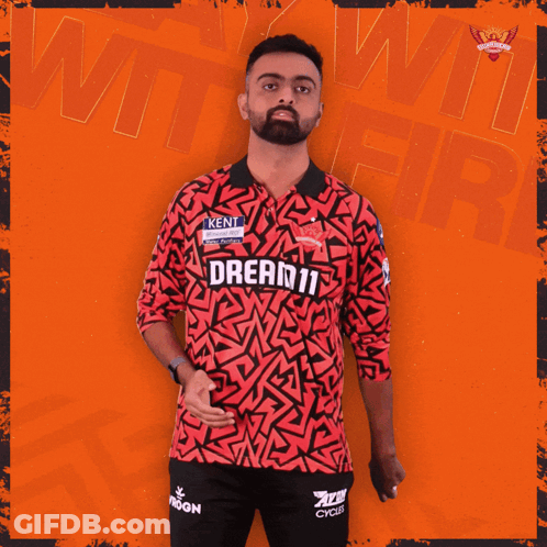 A Man Is Wearing A Red Shirt That Says Dream11 GIF