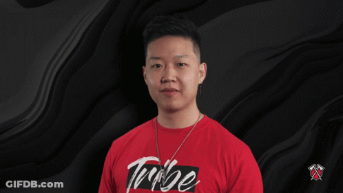 A Man Is Wearing A Red Shirt That Says Tribe On It GIF