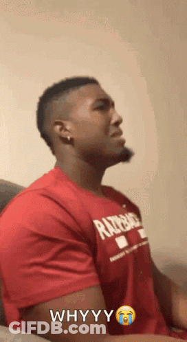 A Man Is Wearing A Red Shirt That Says Whyyy GIF